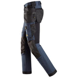 Navy Snickers AllroundWork 4-way Stretch Softshell Trousers Holster Pockets-6275 Snickers -Online Snickers Full stretch trousers that feature windproof softshell material and elastic panels,  a combination that provides wind protection, freedom of movement and efficient ventilation. Stretch CORDURA® knees offer added durability and combines with pre-bent legs to ensure optimal fit.