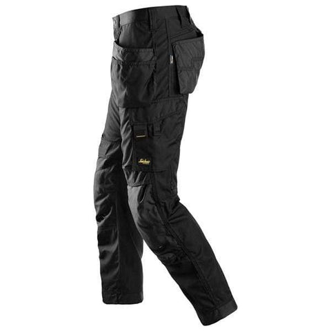 Black Snickers All round Work, Work Trousers with Kneepad & Holster Pockets - 6201 - snickers-online  Everyday use trousers with holster pockets offering comfort, durability and practical storage during work in various environments. The work trousers are built with hardwearing CORDURA® fabric for enhanced durability and feature KneeGuard™ system for robust knee protection. In addition, a stretch gusset at the crotch provides flexibility and ease of movement. Holster pockets